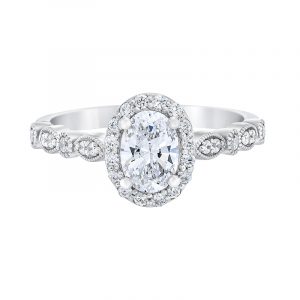 oval halo ring features 1CT total of diamonds with a 3/4CT center