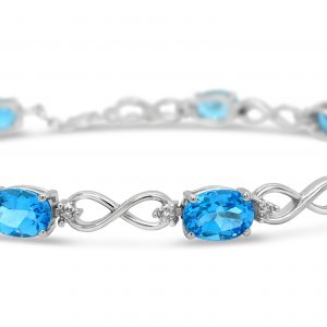 Infinity Link Bracelet with Oval Blue Topaz and diamonds